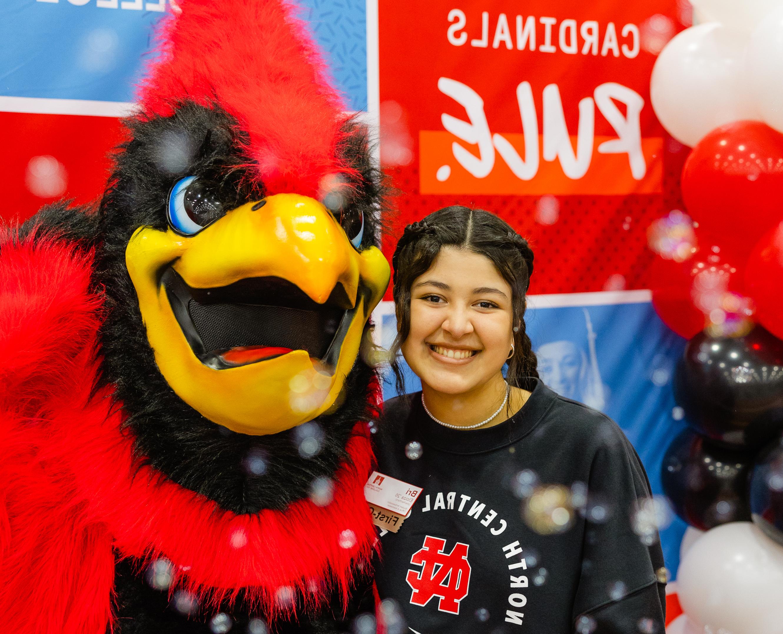 Student posing with Chippy the Mascot